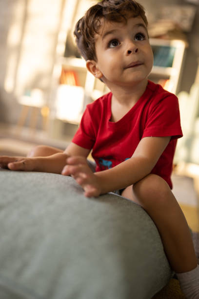 istock Little boy sitting on a pillow 1500023928