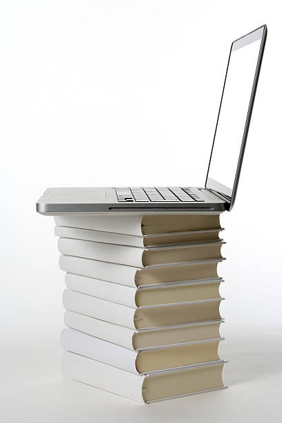 istock Laptop on the stacked blank books on white background 150002414