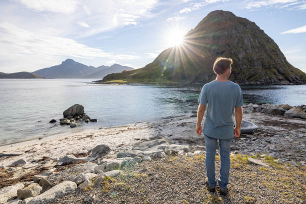 istock Man walks on the coastline and admires nature 1500024703