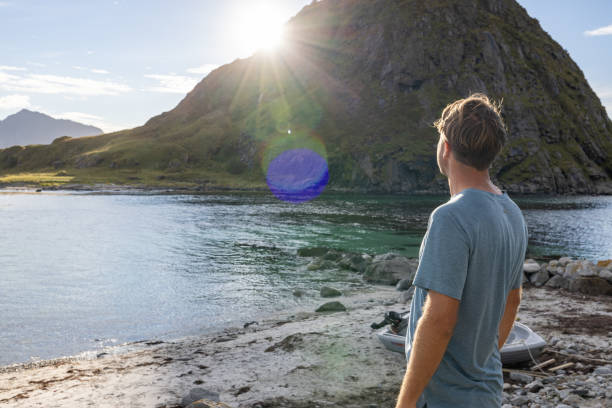 istock Man walks on the coastline and admires nature 1500024761