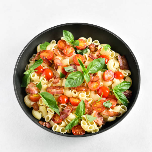 istock Tomato and bacon pasta in cooking pan 1500024869