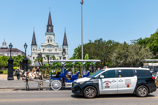 New Orleans, USA. 9 June 2023. St. Louis Cathedral in central New Orleans, with a taxi