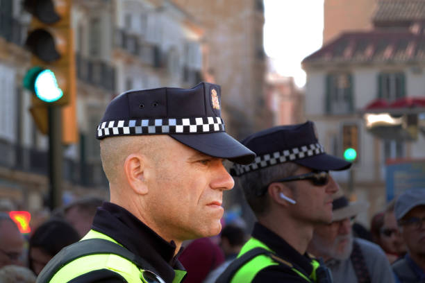 Close-up of a police man observing a procession during holy week