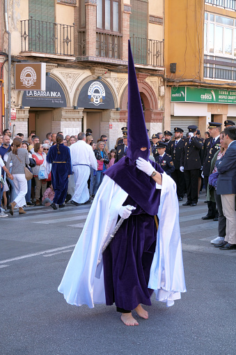 Nazareno, or penitent, walking barefoot, in the procession of Rico brotherhood on holy wednesday