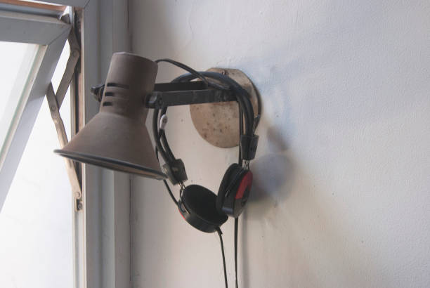 istock Vintage wall lamp next to the window 1500039985