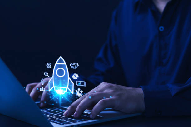 istock Businessman with icon rocket and flying with blue light icon on virtual screen. 1500041232
