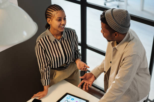 istock Two young confident African American architecture designers having discussion 1500042168