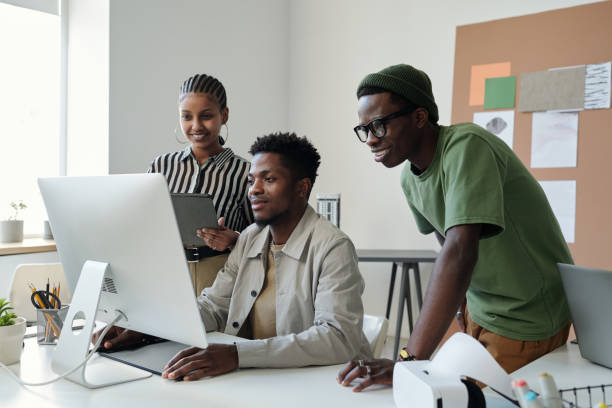 istock Three young African American designers looking at computer screen 1500042729