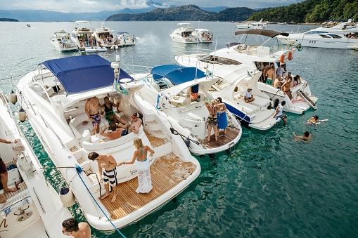 angra dos reis, Brazil – June 11, 2023: A group of people enjoying a leisurely day out on a boat in a picturesque sea