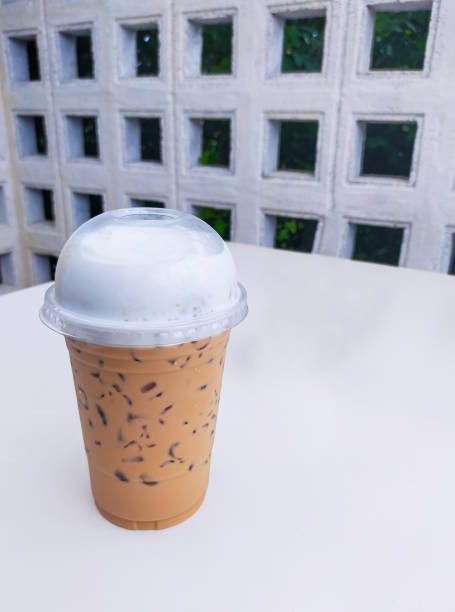 The Thai tea on the table is a delightful and refreshing beverage that captures the unique flavors of Thailand. Its vibrant orange color and creamy texture make it an irresistible treat. on Thai tea .