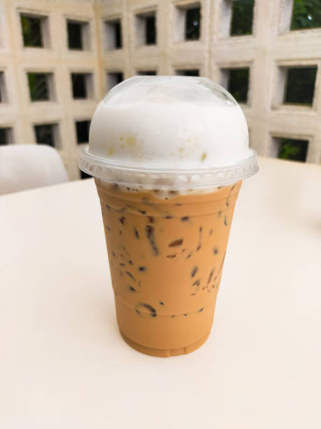 The Thai tea on the table is a delightful and refreshing beverage that captures the unique flavors of Thailand. Its vibrant orange color and creamy texture make it an irresistible treat. on Thai tea .