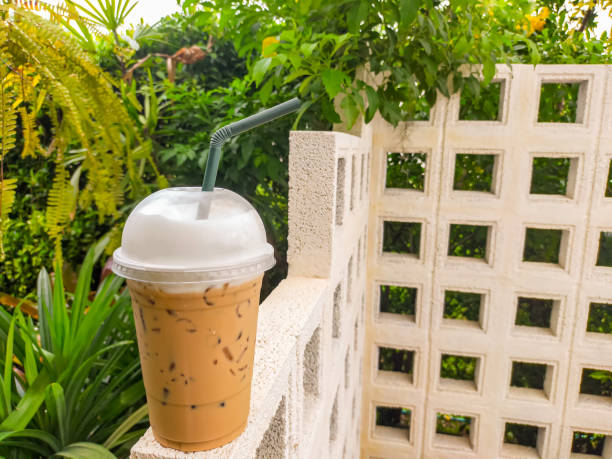 The Thai tea on the table is a delightful and refreshing beverage that captures the unique flavors of Thailand. Its vibrant orange color and creamy texture make it an irresistible treat. on Thai tea .