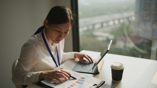 Businesswoman working with laptop in Office