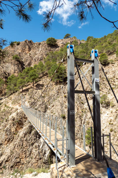 Famous suspension bridge on the Saltillo hiking trail near Canillas de Aceituno in Andalucia, Spain