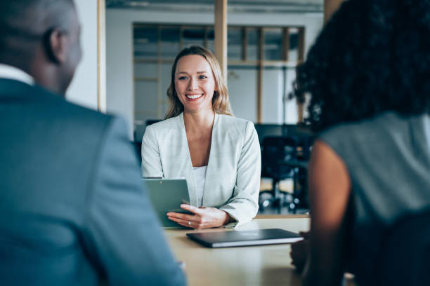 istock Group of business persons talking in the office. 1500054538