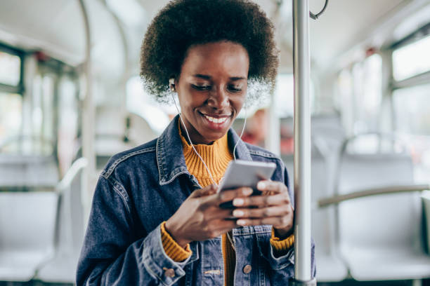 istock Young woman traveling by bus and using smart phone. 1500054607