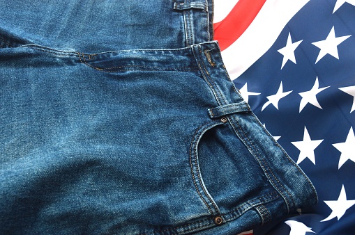 men's jeans on the background of the American flag