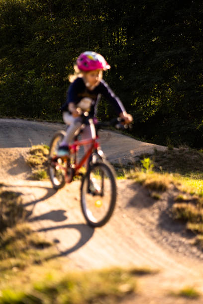 little girl riding with her bike on a pumptrack - ten speed bicycle imagens e fotografias de stock