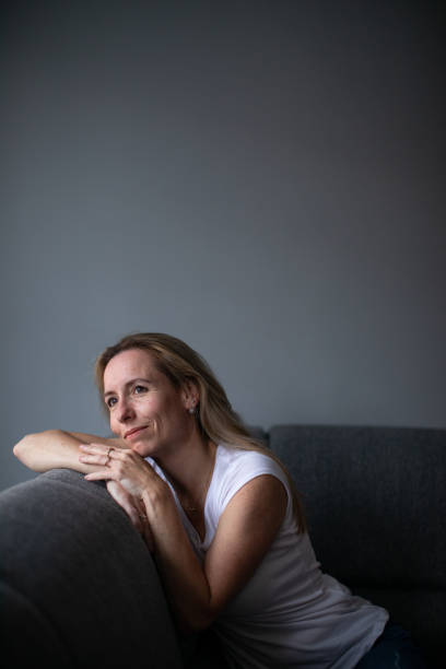 istock Depressed mid-aged woman at home feeling sad, lonely, anxious 1500056498