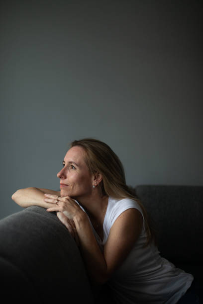 istock Depressed mid-aged woman at home feeling sad, lonely, anxious 1500056551