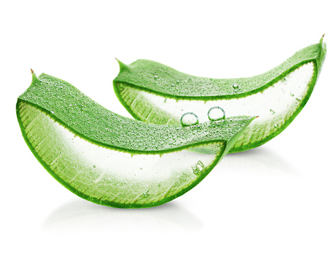 two cut slices of aloe vera in water drops on a white isolated background