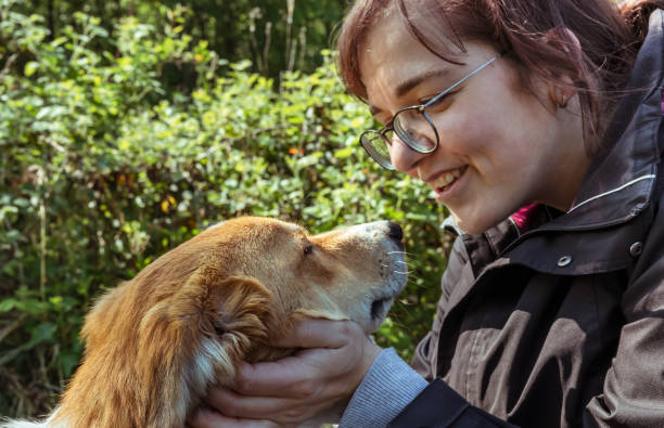 istock Young woman speaking with her dog 1500062598