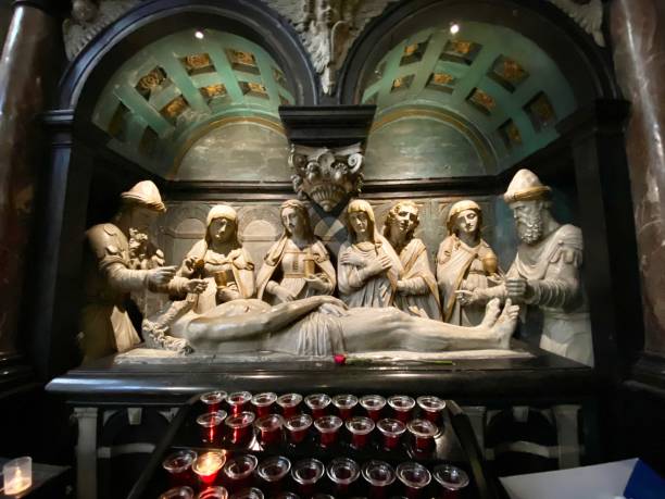 the anointment of jesus in the tomb - is a carrara marble carving inside the cathedral of st. michael and st. gudula in brussels, belgium. touring the 11th century cathedral of st. michael and st. gudula in brussels, belguim. saint michaels stock pictures, royalty-free photos & images