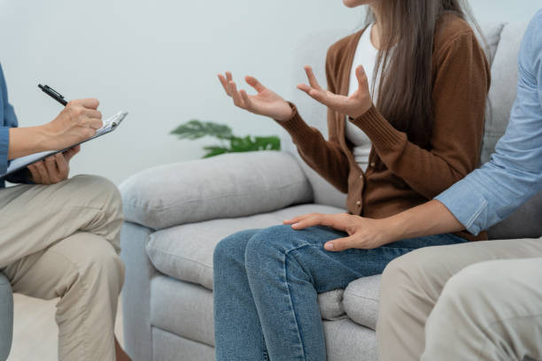 istock Couple support each while discussing family issues with psychiatrist. Husband encourages and empathy wife suffers depression. psychological, save divorce, Hand in hand together, trust, care, mental health 1500064773