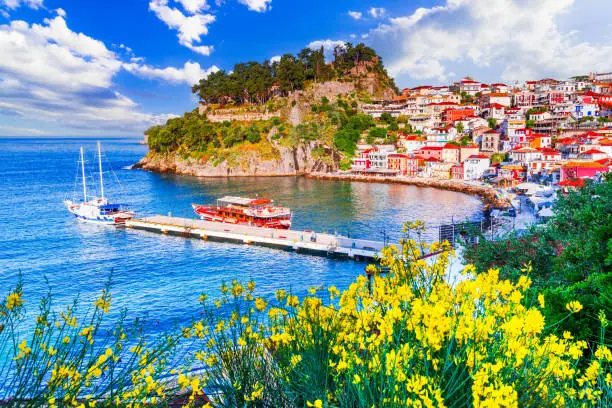 Parga, Greece. Picturesque coastal town, stunning beaches, turquoise waters, historical charm, and a vibrant summer atmosphere.