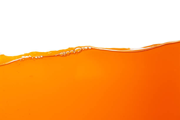 istock Orange juice isolated white background,orange juice texture on white background,Close up bright orange juice texture for health and nature waves 1500071954