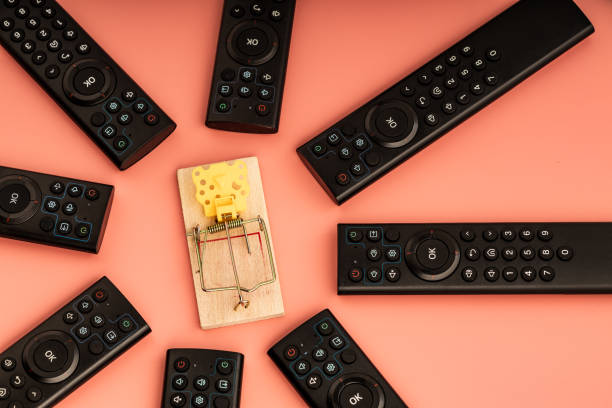 https://media.istockphoto.com/id/1500074221/photo/the-mousetrap-is-surrounded-by-tv-remotes.jpg?s=612x612&w=0&k=20&c=Y9hYAP42EfesOswV5auK6CfaDasW8l_e4D3FkVpLyjE=