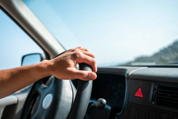 istock A hand on the wheel of a van. 1500074893
