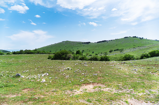 View over the hilly landscape of the Croatian Coastal Mountains in early summer.