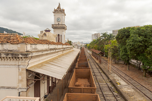 Empty wagons used to transport iron ore passing in front of the Juiz de Fora Railway Station, Minas Gerais, Brazil.