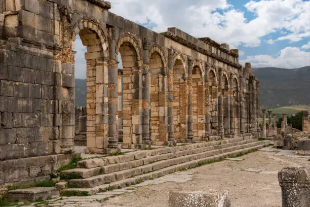 Photo of Iconic ruins of the forum in Volubilis, an old ancient Roman city in Morocco