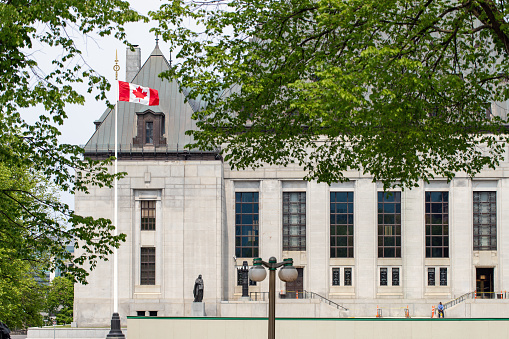 Ottawa, Canada - May 19, 2023: Supreme Court of Canada, building with flag