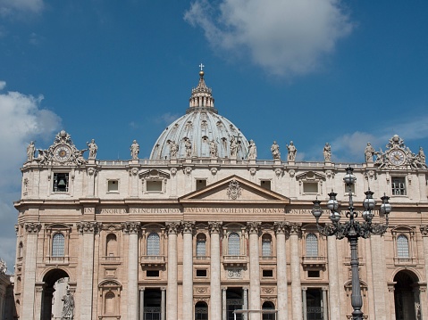 A church building with intricate detail and multiple ornate statues in Rome