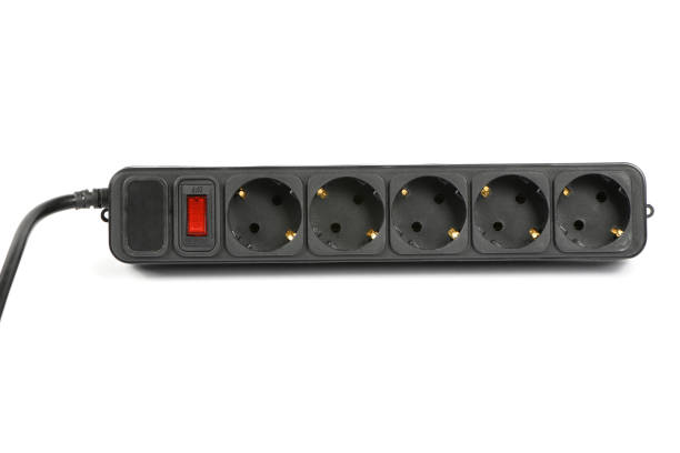 istock Black plastic electrical extension cord for household appliances isolated on white. 1500078286