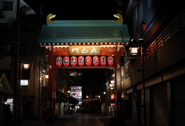 Gate with Lanterns in Asakusa, Taito Ward, Japan May 24, 2023 - Taito Ward, Japan: A gate with illuminated red lanterns marks a street in the restaurant and nightlife district in Asakusa. toilet sign in japanese style stock pictures, royalty-free photos & images