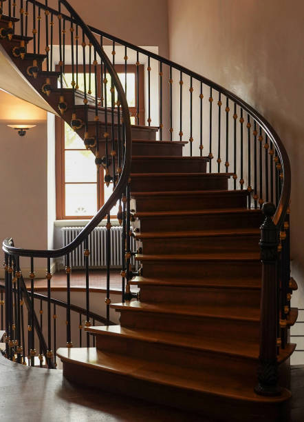 istock Spiral staircase with wooden railings. 1500078758