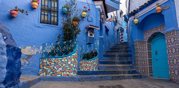 Vibrant blue colored alley in downtown Chefchaouen, Morocco