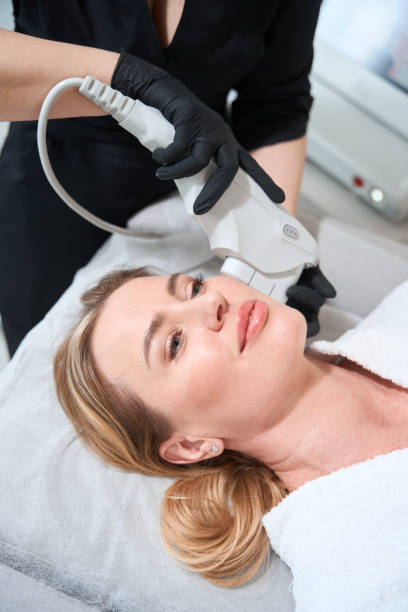 istock Client lies on a cosmetology couch on hardware rejuvenation procedure 1500080636