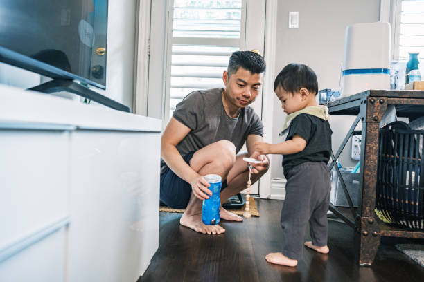 istock Young Korean Father at Home playing with toddler son 1500082010