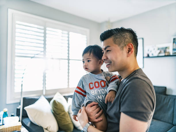 istock Young Korean Father at Home playing with toddler son 1500083006