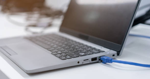 istock close up on computer port interface with blue line lan cable connected to transfer bandwidth and usage data to global network for internet technology transmission service concept 1500083476