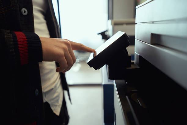 istock Man uses a photocopier in a coworking space 1500084725