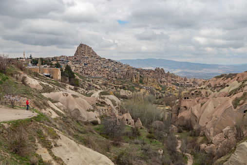 A picture of the Uchisar town and the Pigeon Valley on a cloudy day.