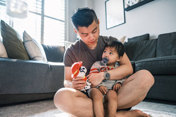 istock Young Korean Father at Home playing with toddler son 1500085500