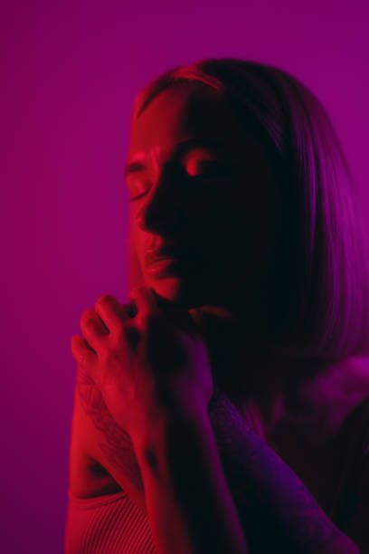 istock Woman dreaming in studio in neon light 1500089409