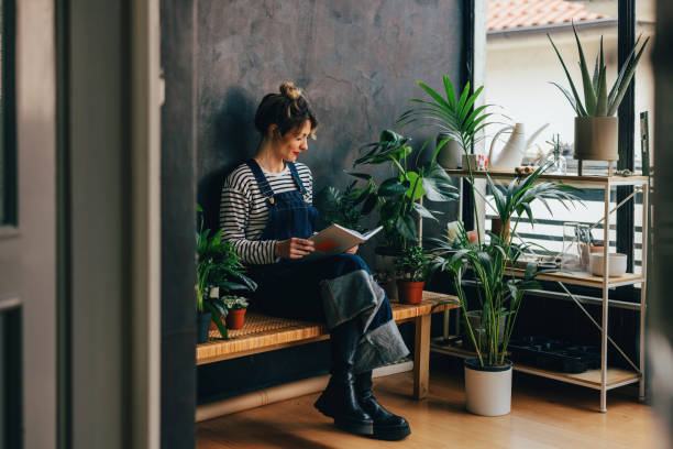 istock A Happy Beautiful Blonde Florist Learning About Plants 1500089832